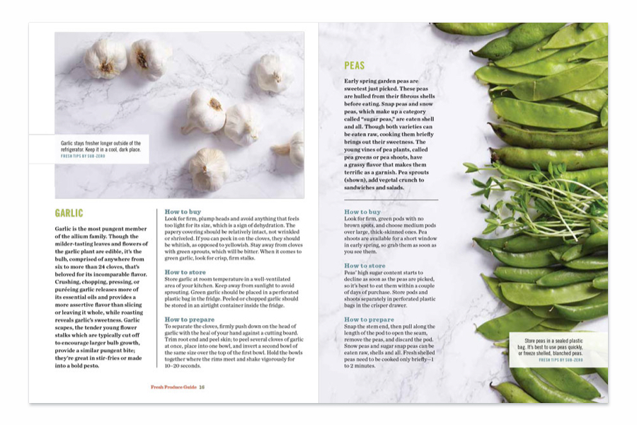 Seven whole garlic shown partially peeled on marble surface, on the adjacent spread green peas spread out on same surface.